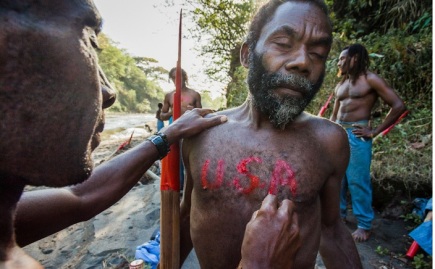 Lamakara villagers paint USA on theirs chests and backs. For them the United States is a dream country, from where they except to receive "cargo", that was promised by John Frum.